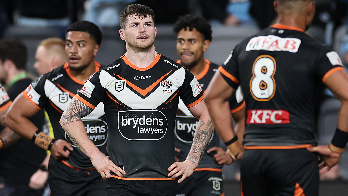 John Bateman of the Tigers reacts after a Sharks try.