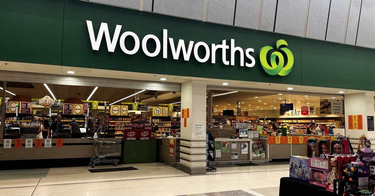 Woolworths sales up but supermarket cuts profit forecast amid petrol price spike