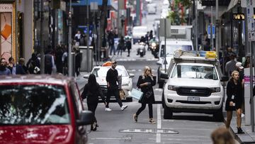 Pedestrians on Little Bourke Street in Melbourne