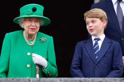Queen Elizabeth II and Prince George of Cambridge stand on the balcony of Buckingham Palace following the Platinum Pageant on June 5, 2022 in London, England. (Photo by Max Mumby)