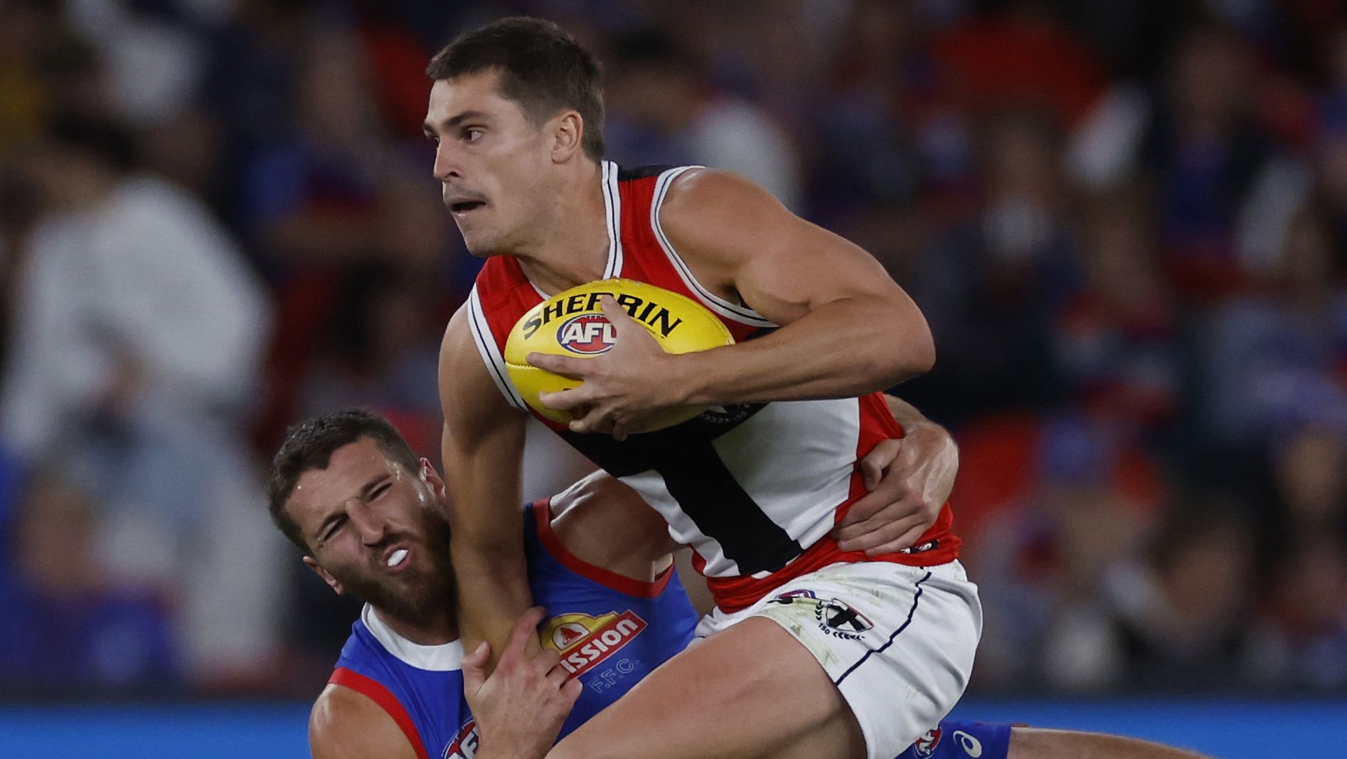Marcus Bontempelli tackles Jack Steele during the round two AFL match between the Western Bulldogs and St Kilda Saints.