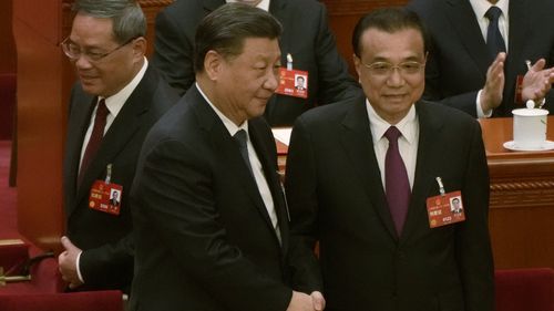 President Xi Jinping shakes hands with former premier Li Keqiang