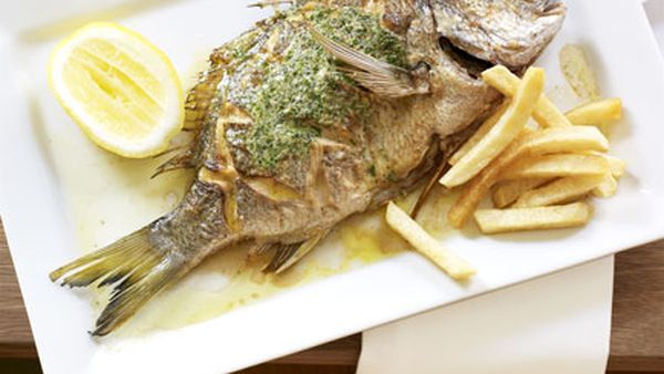 Whole sea bream with herb butter