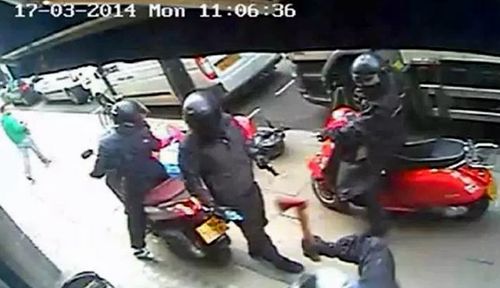 This CCTV image from 2014 shows axe-wielding moped robbers in London. (Metropolitan Police).