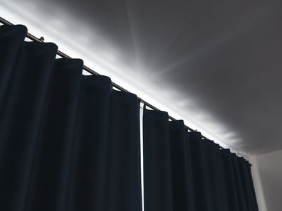 the curtains are drawn and block out the daylight