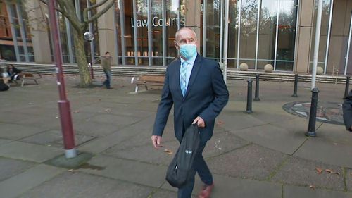Chris Dawson leaves court on May 26.