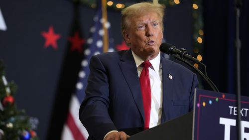 Former US President Donald Trump speaks during a commit to caucus rally, Tuesday, Dec. 19, 2023, in Waterloo, Iowa. 