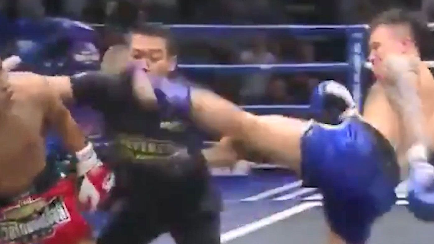 Muay Thai fighter drops referee with brutal head kick