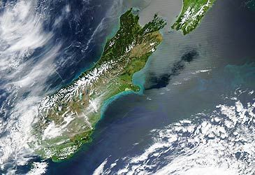 Where does the South Island rank amongst the world's largest islands by land area?