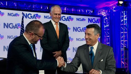 Australian Chief Minister Andrew Barr, left, shake hands with National Governors Association (NGA) Chair, Governor Brian Sandoval of Nevada. (AAP)