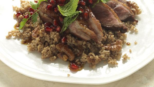 Cracked wheat and walnut pilaf with duck and pomegranates