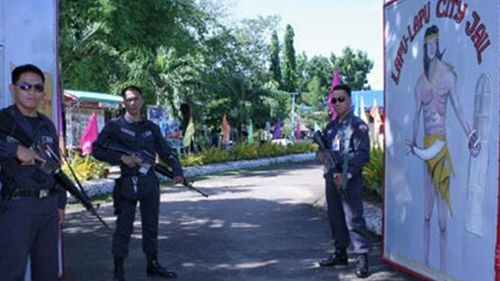 Armed guards stand at the gate of  Lapu-Lapu city jail. The jail is home to almost 1700 prisoners, despite being designed to hold 150 inmates. Source:  Capital FM