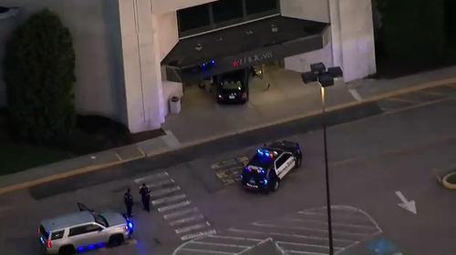 The suspect crashed a car into the entrance of a department store. (ABC News)