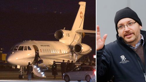 Hostages, including Washington Post journalist Jason Rezaian, were flown out of Iran on a private jet to Switzerland. (AAP)