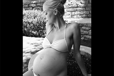 Model-turned-actress, Jaime King, shared this beautiful backyard shot of her full belly with her Instagram followers, writing "Summer with baby and father." The <i>Hart of Dixie</i> star is currently expecting her first child with hubby/director, Kyle Newman.<br/><br/>Image: Instagram @jaimeking