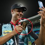 Brisbane Heat player Spencer Johnson shows off his KFC &#x27;player of the match&#x27; medal after the BBL final.