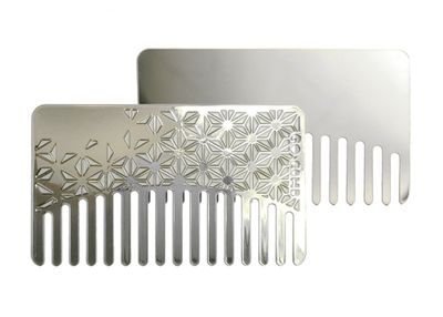Choose a dual-purpose comb in a reflective stainless steel that not only slips into a credit card holder but offers a discreet, unexpected mirror.
