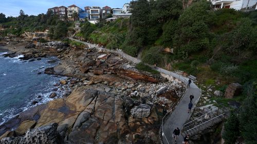 People are exercising along the Bondi coastal walk in Sydney.