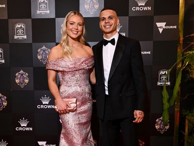 Bobby Hill of the Collingwood Magpies and partner Georgia Devlin arrive ahead of the 2024 Brownlow Medal at Crown Palladium on September 23, 2024 in Melbourne, Australia.