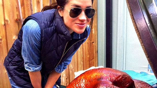 Meghan Markle cooking a Thanksgiving turkey in 2016
