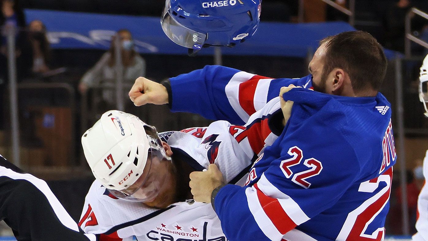 Anthony Bitetto of the New York Rangers and Michael Raffl of the Washington Capitals fight during the first period at Madison Square Garden on May 05, 2021 in New York City.