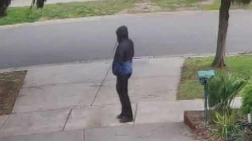 As police yesterday charged Adrian Basham with one count of murder, authorities also released images of a hooded man outside of Ms Fraser's home on teh day of her death, July 23. Picture: Supplied.