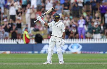 Rachin Ravindra celebrates his half-century during day three of the first Test between Australia and New Zealand.