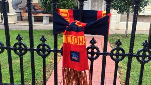 Distraught Crows fans declare #weflyasone with scarves and guernseys tribute