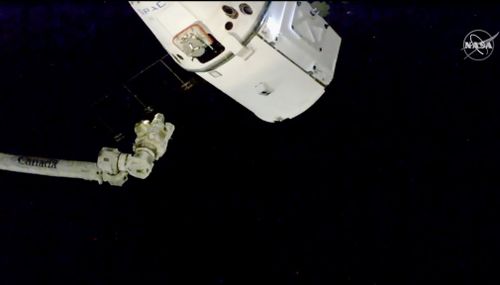 A capsule containing Christmas treats including smoked turkey and fruitcake has arrived at the International Space Station.