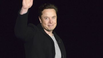 Elon Musk waves while providing an update on Starship, on Feb. 10, 2022, near Brownsville, Texas. Twitter on Thursday, Dec. 15, 2022, suspended the accounts of journalists who cover the social media platform and Musk.