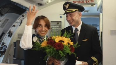 A captain proposed to a flight attendant aboard a flight to Krakw, Poland.