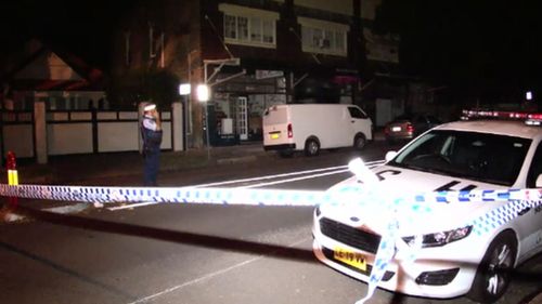 Police believe man found lying in middle of Sydney street was assaulted