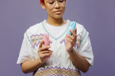 Woman holding sex toys
