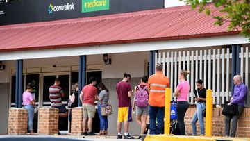 A long queue around a Centrelink office in Brisbane.