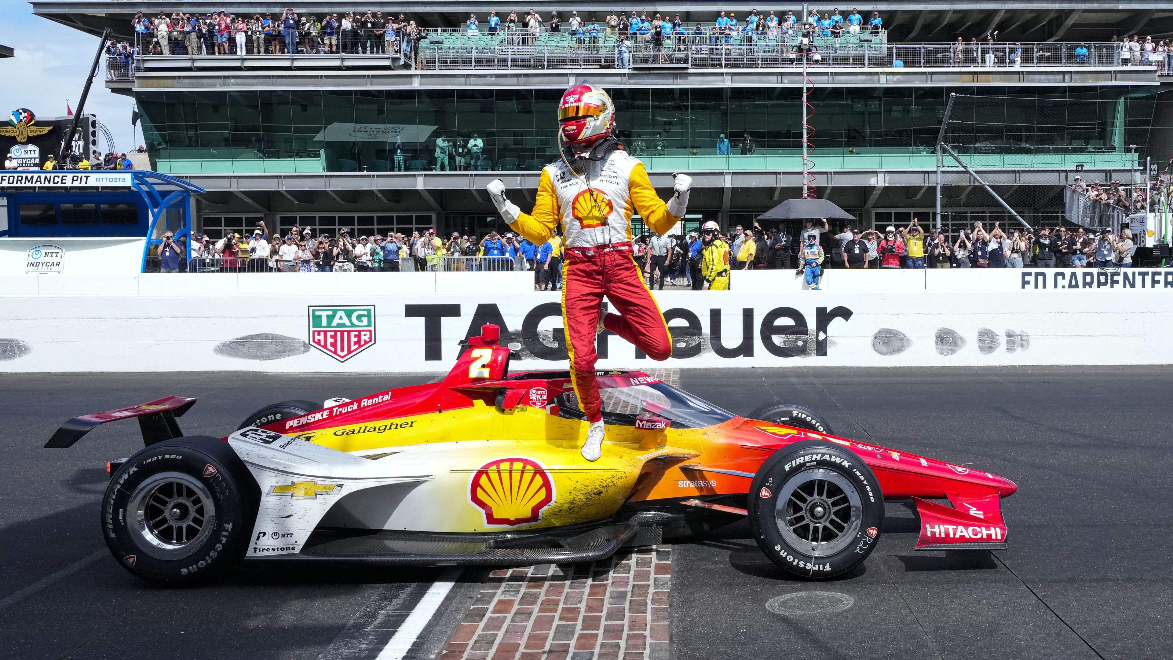 Josef Newgarden celebrates on the finish line after winning the Indianapolis 500.