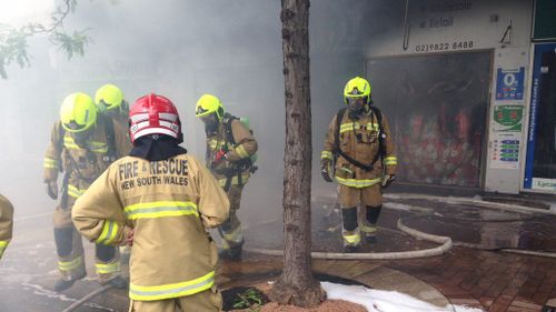 Firefighters have contained the Liverpool shop blaze that had spread to three other businesses. (FRNSW)