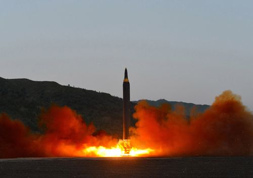 An undated photo released 15 May 2017 by North Korean Central News Agency (KCNA) showing the test-firing of a new ground-to-ground medium long-range strategic ballistic rocket Hwasong-12 on 14 May 2017.