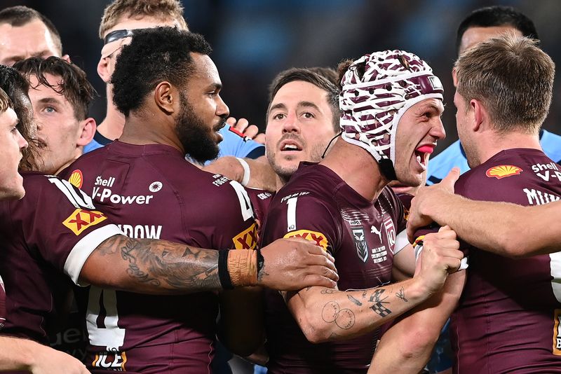 Maroons players celebrate a try during the 2021 Origin series.