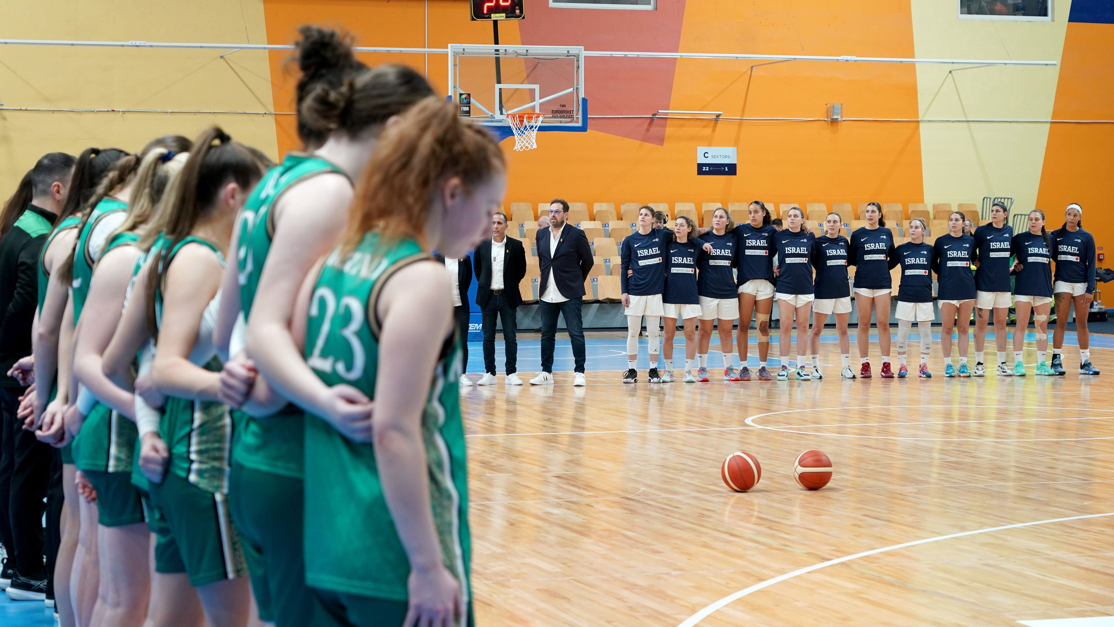 The Ireland women&#x27;s basketball team line-up by their bench as the Israel team stands on centre court for the pre-match formalities ahead of their EuroBasket qualifier.