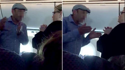 A still from footage of a man arguing with a flight attendant after an alleged racist rant. (Facebook)