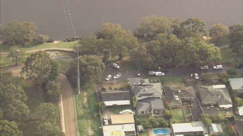 A 28-year police officer is fighting for his life in Perth after police say he was run over and dragged almost 20 metres while performing an arrest. Neighbours were forced to stay inside today as police examined the scene.