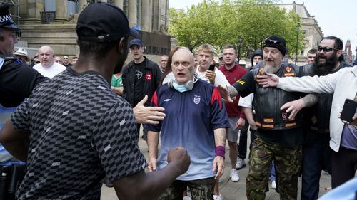 A group referring to themselves as "patriots" clash with anti-racism protesters at the Cenotaph during a Black Lives Matter protest on June 13, 2020 in Manchester, England. 
