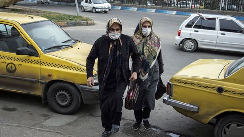 Women wear face masks as a precaution against the outbreak of Coronavirus..With the spread of coronavirus in the world, the virus has hit Iran and Qom, Rasht has the highest number of people with coronavirus in Iran. Currently schools and universities in Gilan province are closed and people move less in the city.