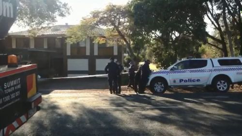 Police at the Starkey Street home in Wellington Point. (9NEWS)