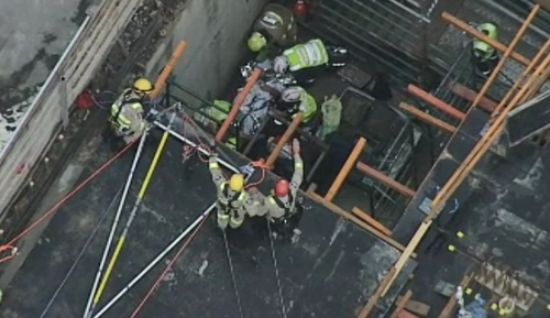 Emergency crews worked to free the man who fell more than 4 metres. (9NEWS)