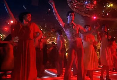 John Travolta in Saturday Night Fever 'Night Fever' line dance scene (Paramount)