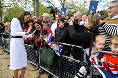 Catherine, Princess of Wales, meets well-wishers during a walkabout on the Mall outside Buckingham Palace ahead of the coronation of Britain's King Charles and Camilla, Queen Consort on May 5, 2023 in London, England. 