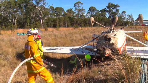 Fire crews doused the plane to prevent a small fire from spreading. (9NEWS)