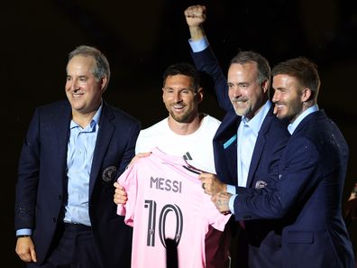 Managing Owner Jorge Mas, Lionel Messi, Co-Owner Jose Mas, and Co-Owner David Beckham pose during "The Unveil" introducing Lionel Messi hosted by Inter Miami.