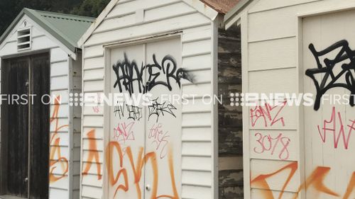 Eleven beach boxes at Point King Beach, Sorrento, have been tarnished by graffiti. (9NEWS)